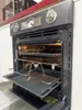 An open oven with racks and a baking tray extended. Produktbild-Vorschau