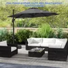 An outdoor patio set with a large cantilever umbrella, sofa, armchair, and coffee table. Náhled obrázku produktu