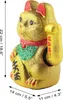 A golden Maneki-neko (lucky cat) figurine with red and green accents, shown from the side. Produktbild-Vorschau