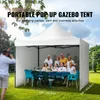 A group of people are gathered around a table under a white pop-up gazebo in a grassy outdoor setting. Anteprima dell’immagine prodotto