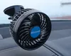 A black car fan with a blue Mitchell logo is mounted on a car dashboard. Produktbild-Vorschau