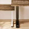 Close-up of the legs of two desks, one white and one black, on a wooden floor. Náhled obrázku produktu