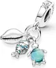A silver charm with three dangling pendants: a seashell, a fish, and a turtle with a blue glass body. Anteprima dell’immagine prodotto