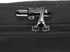 A close-up view of a black rucksack's zipper and lock mechanism. Anteprima dell’immagine prodotto