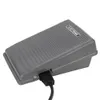 A gray electronic foot pedal with a black cord attached. Náhľad obrázku produktu
