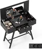 A black vanity table with a mirror and various makeup items, shown from a slightly elevated angle. Podgląd zdjęcia produktu