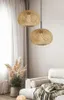 A living room scene with two bamboo pendant lights hanging above a sofa and a potted plant. Náhled obrázku produktu