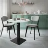 A modern kitchen with a small dining set in the foreground. Náhľad obrázku produktu