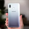 A hand holding a Samsung Galaxy A40 phone with a gradient back. Náhled obrázku produktu