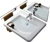 Two white ceramic sinks with chrome faucets and brown towels on a towel rack. Anteprima dell’immagine prodotto