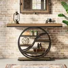 A console table with shelves is displayed against a brick wall, with a mirror above it and a plant to the side. Anteprima dell’immagine prodotto