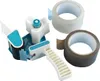 A set of tape dispensers and rolls of tape on a white background. Produktbild-Vorschau