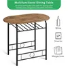 A multifunctional dining table with a wooden top and black metal frame, featuring a lower shelf for storage. Informational text and icons about its storage capabilities are displayed on the right. Produktbild-Vorschau