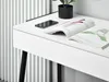 A close-up view of a white desk with a magazine and a smartphone on it. Anteprima dell’immagine prodotto