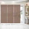 A room interior with large sliding panel curtains covering a window or door, with a console table and mirror on the right. Produktbild-Vorschau