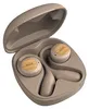A pair of cream-colored wireless earbuds with wood accents, shown inside their open charging case. Voir les images du produit