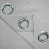 Close-up view of grommets on a gray curtain. Produktbild-Vorschau