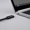 A close-up shot of a USB-C cable and a laptop. Anteprima dell’immagine prodotto
