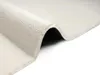 A close-up, angled view of a cream-colored rug, folded to show its texture and underside. Produktbild-Vorschau