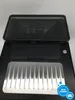The top view of a black coffee machine with a silver drip tray. Produktbild-Vorschau