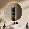 A modern bathroom vanity with a round LED mirror above a sink. Produktbild-Vorschau