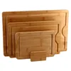 A set of four nested bamboo cutting boards of varying sizes, with the smallest one propped up in front. Produktbild-Vorschau