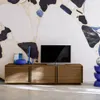 A modern living room with a TV stand and a large abstract mural on the wall. Anteprima dell’immagine prodotto