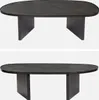 Two identical images of an oval coffee table with a dark stone veneer top and dark wood legs, presented against a white background. Produktbild-Vorschau