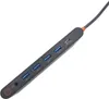 A close-up, angled view of a dark gray USB-C hub with multiple USB 3.1 ports and a USB 3.1 Type-C port, set against a white background. Produktbild-Vorschau