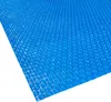 A blue solar pool cover with a bubble texture, laid flat on a white background. Anteprima dell’immagine prodotto