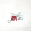 A collection of hardware components including a wrench, screws, wall plugs, and washers, laid out on a light gray and white surface. Voir les images du produit