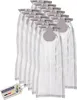 A stack of vacuum cleaner bags with a tag attached. Produktbild-Vorschau