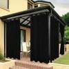 Outdoor patio area with black curtains. Náhľad obrázku produktu