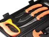 A set of knives and a saw in a black carrying case. Náhled obrázku produktu
