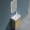 A modern bathroom vanity with a sink and mirror mounted on a blue wall. Produktbild-Vorschau