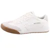 A white SKECHERS sneaker with a brown sole is shown from the side against a white background. Produktbild-Vorschau
