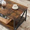 A close-up view of a rustic-style coffee table with a basket and a cup of coffee on it. Produktbild-Vorschau