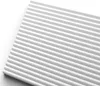 A close-up, angled view of a white, ribbed decorative panel. Podgląd zdjęcia produktu