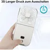A hand is holding a white portable fan. Produktbild-Vorschau