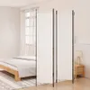 A bedroom scene with a bed and a room divider. Anteprima dell’immagine prodotto