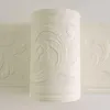A roll of textured wallpaper border with an embossed floral pattern. Náhľad obrázku produktu
