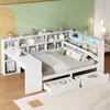 A white bed frame with integrated shelving, a desk, and drawers, set up in a room with a green and yellow wall. Náhled obrázku produktu