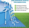 A blue pool ladder and protective mats are shown on a grassy lawn next to a pool. Náhled obrázku produktu