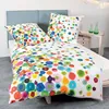 A bed with a duvet cover and pillows featuring a colorful polka dot pattern. Produktbild-Vorschau