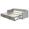 A gray sofa bed is shown in its extended state, revealing the mattress support structure. Produktbild-Vorschau