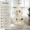 A multi-level cat tree with various platforms, hiding spots, and scratching posts, set in a bright, airy room with a window view of the sea. Voir les images du produit