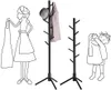 A line drawing illustration showing a woman holding a garment, a coat rack with a hat and coat, and a child holding a garment. Podgląd zdjęcia produktu
