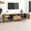 A modern TV stand with a wood finish and black accents, featuring open shelves, drawers, and cabinet doors. A TV is mounted on the wall above it. Podgląd zdjęcia produktu