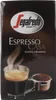 A box of Segafredo Espresso Casa coffee, showing a steaming cup of espresso and a portafilter filled with coffee grounds. Produktbild-Vorschau