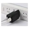 A black power adapter plugged into a white power strip with two white cables connected. Produktbild-Vorschau
